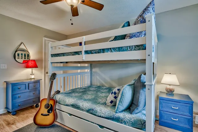 a bedroom with a bed and cabinets