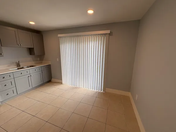 a bathroom with a toilet bathtub window and shower
