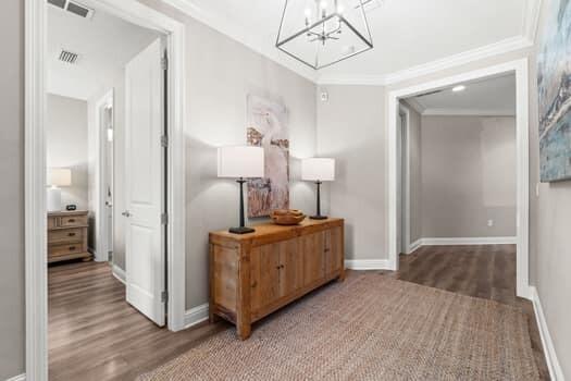 48 Barefoot Cove Freeport, FL 32439 - Photo 16 of 82 a bedroom with a bed and a mirror on a dresser