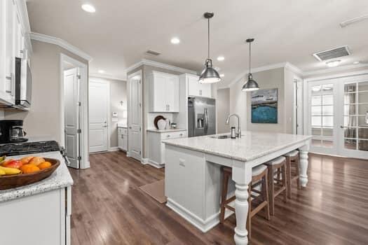 48 Barefoot Cove Freeport, FL 32439 - Photo 24 of 82 a large kitchen with a table and chairs