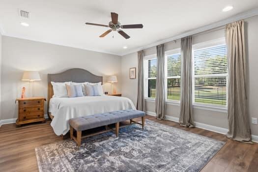 48 Barefoot Cove Freeport, FL 32439 - Photo 30 of 82 a bed sitting in a spacious bedroom next to a window