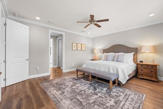 48 Barefoot Cove Freeport, FL 32439 - Photo 31 of 82 a bedroom with a bed and a chandelier