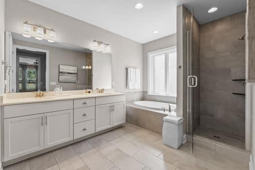 48 Barefoot Cove Freeport, FL 32439 - Photo 33 of 82 a spacious bathroom with a granite countertop tub sink shower and mirror