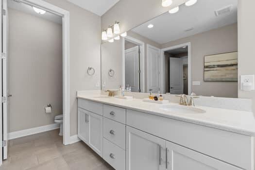 48 Barefoot Cove Freeport, FL 32439 - Photo 34 of 82 a bathroom with double sink and a mirror