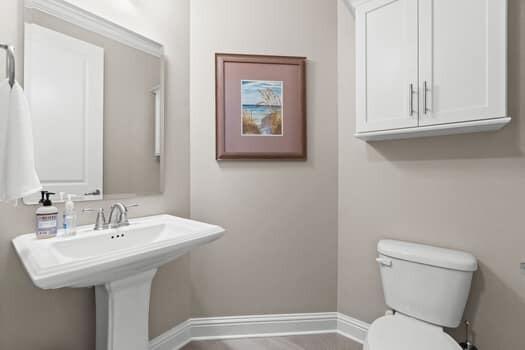 48 Barefoot Cove Freeport, FL 32439 - Photo 43 of 82 a bathroom with a toilet sink and mirror