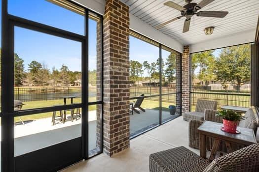 48 Barefoot Cove Freeport, FL 32439 - Photo 48 of 82 a living room with furniture and a floor to ceiling window