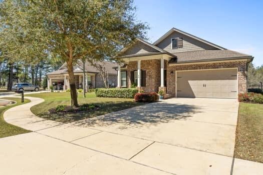 48 Barefoot Cove Freeport, FL 32439 - Photo 56 of 82 a front view of a house with garden