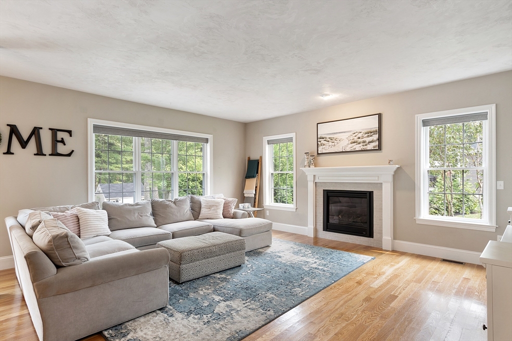 46 Jordan Road Holden, MA 01520 - Photo 9 of 42 a living room with furniture and a fireplace