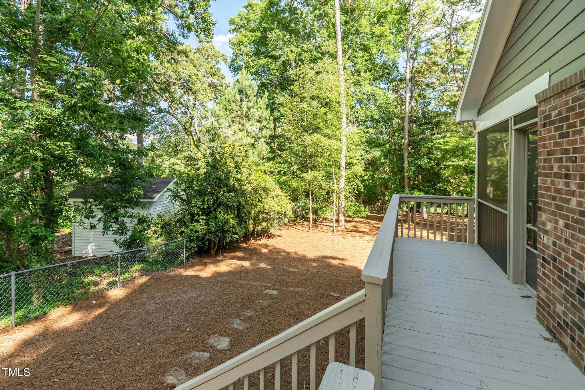 205 Northfield Drive Raleigh, NC 27609 - Photo 12 of 87 a view of a balcony with lawn chairs and wooden fence