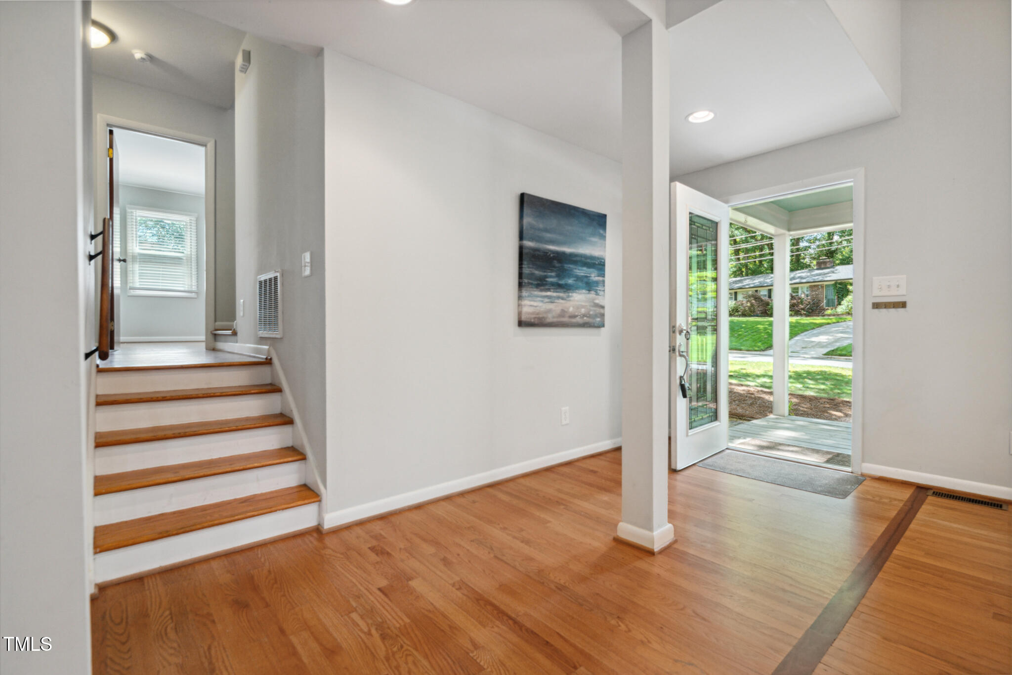 205 Northfield Drive Raleigh, NC 27609 - Photo 14 of 87 wooden floor in an empty room with a window