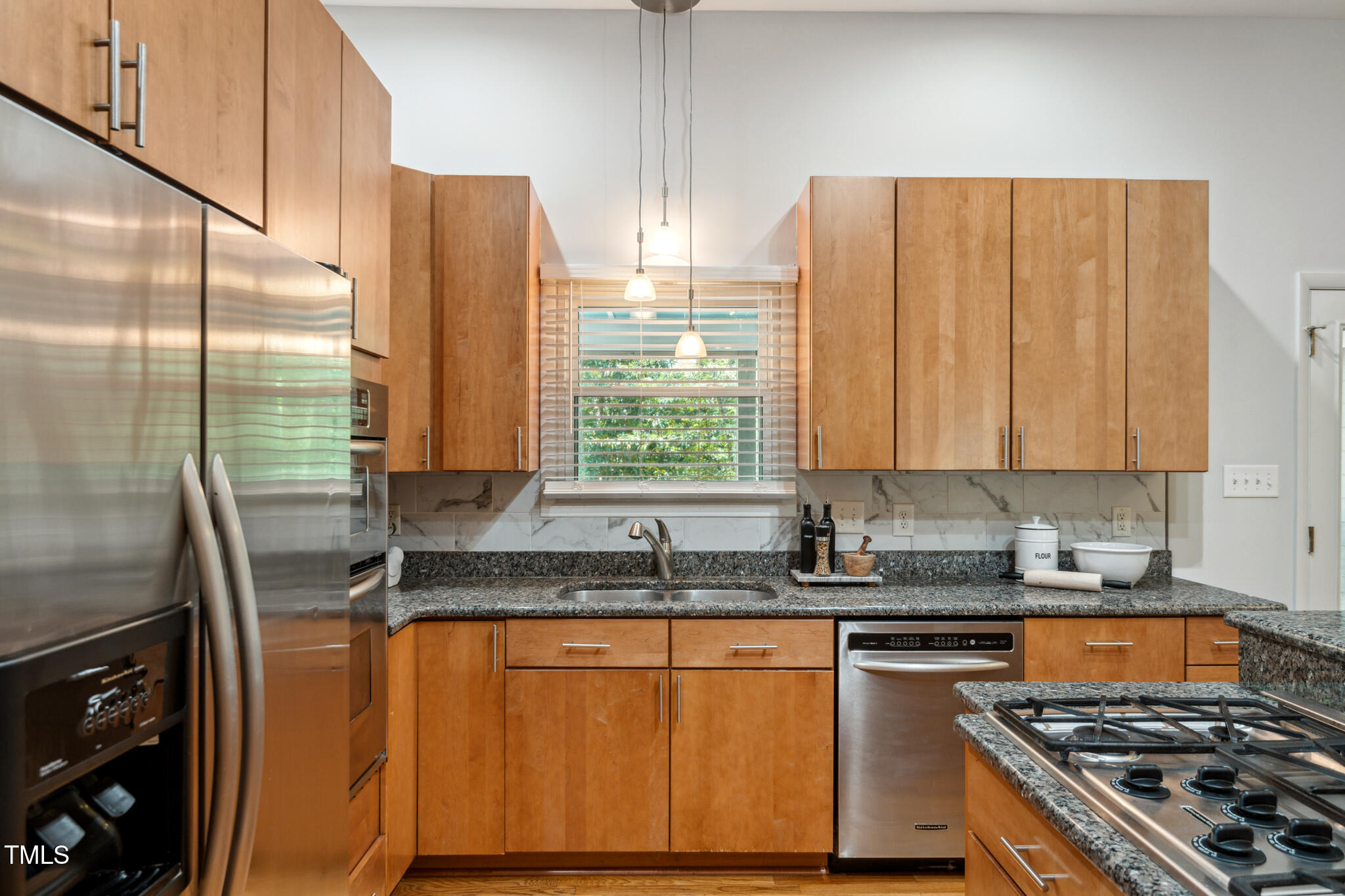 205 Northfield Drive Raleigh, NC 27609 - Photo 25 of 87 a kitchen with stainless steel appliances granite countertop a sink stove and refrigerator