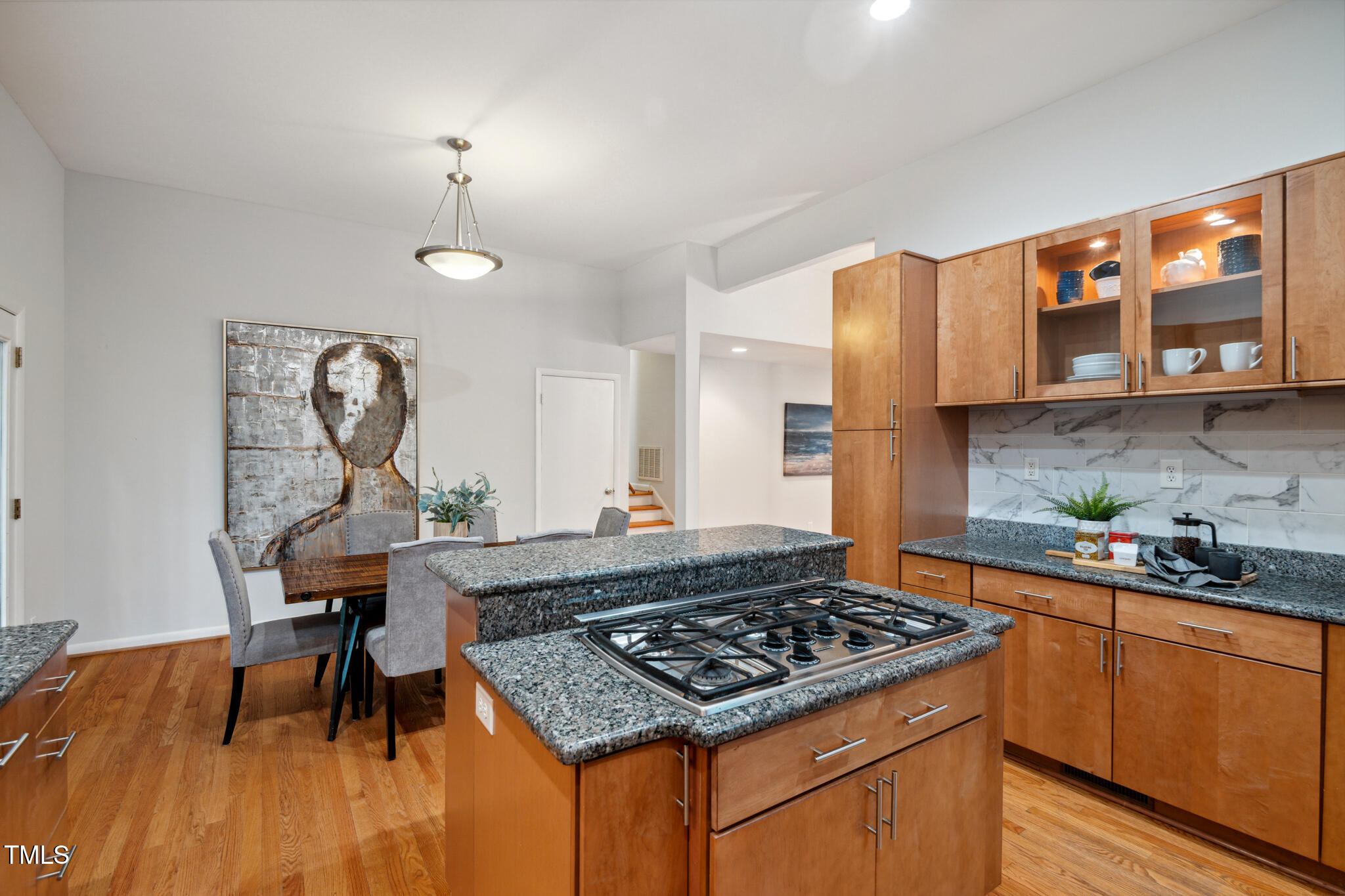 205 Northfield Drive Raleigh, NC 27609 - Photo 27 of 87 a kitchen with stainless steel appliances granite countertop a stove a sink dishwasher and cabinets with wooden floor