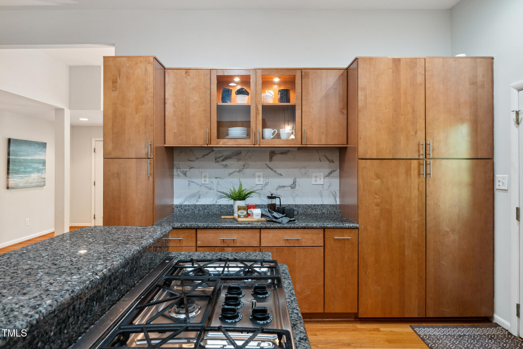 205 Northfield Drive Raleigh, NC 27609 - Photo 28 of 87 a kitchen with granite countertop a refrigerator and a stove