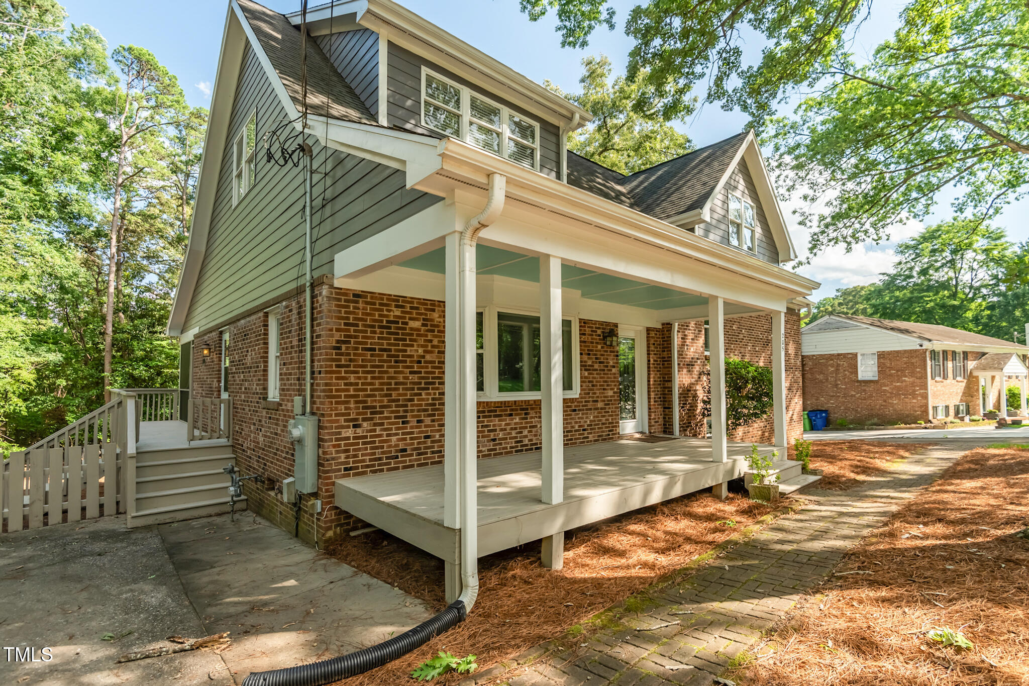 205 Northfield Drive Raleigh, NC 27609 - Photo 3 of 87 a view of a house with wooden walls and a yard
