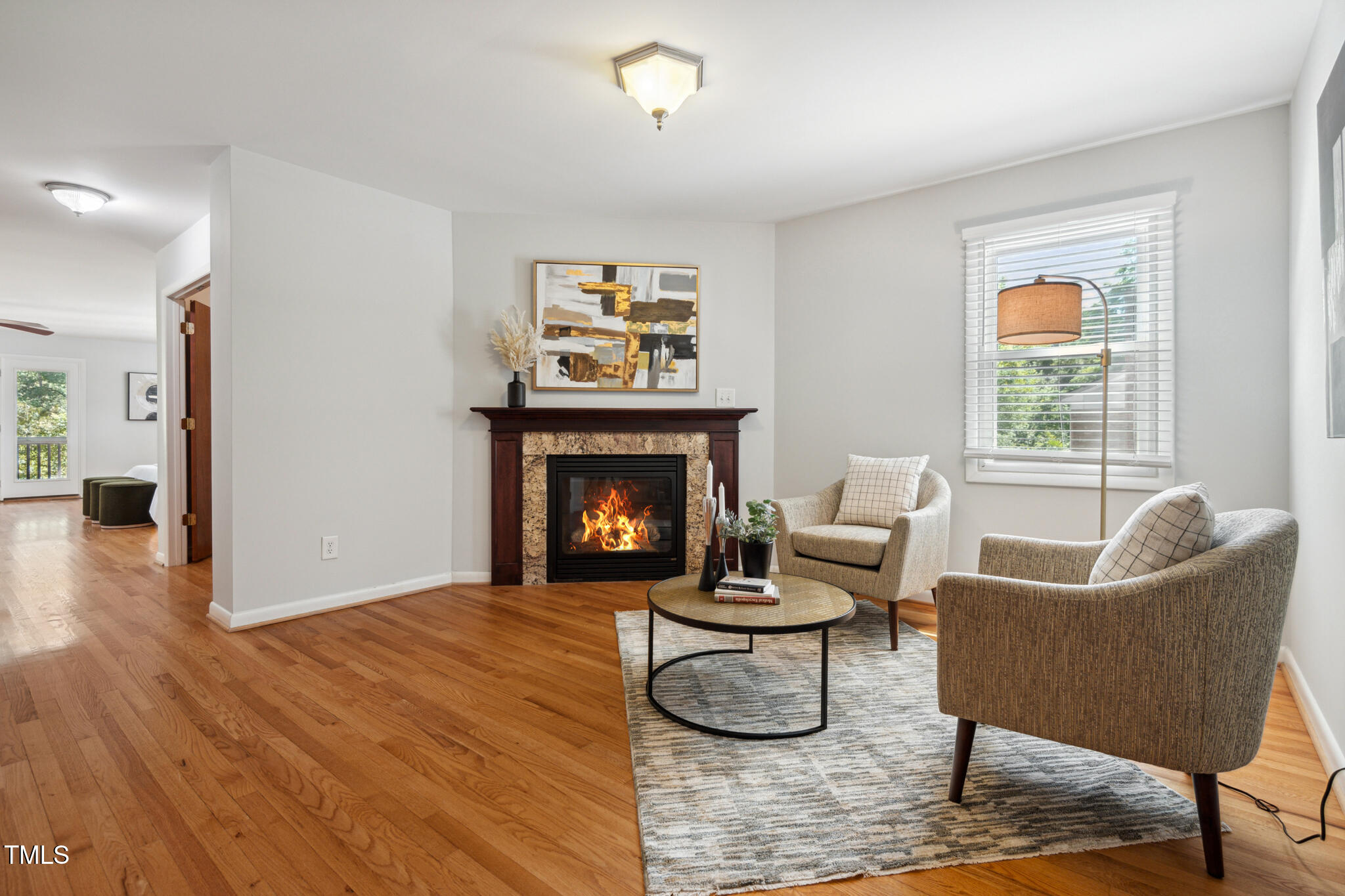 205 Northfield Drive Raleigh, NC 27609 - Photo 36 of 87 a living room with furniture and a fireplace