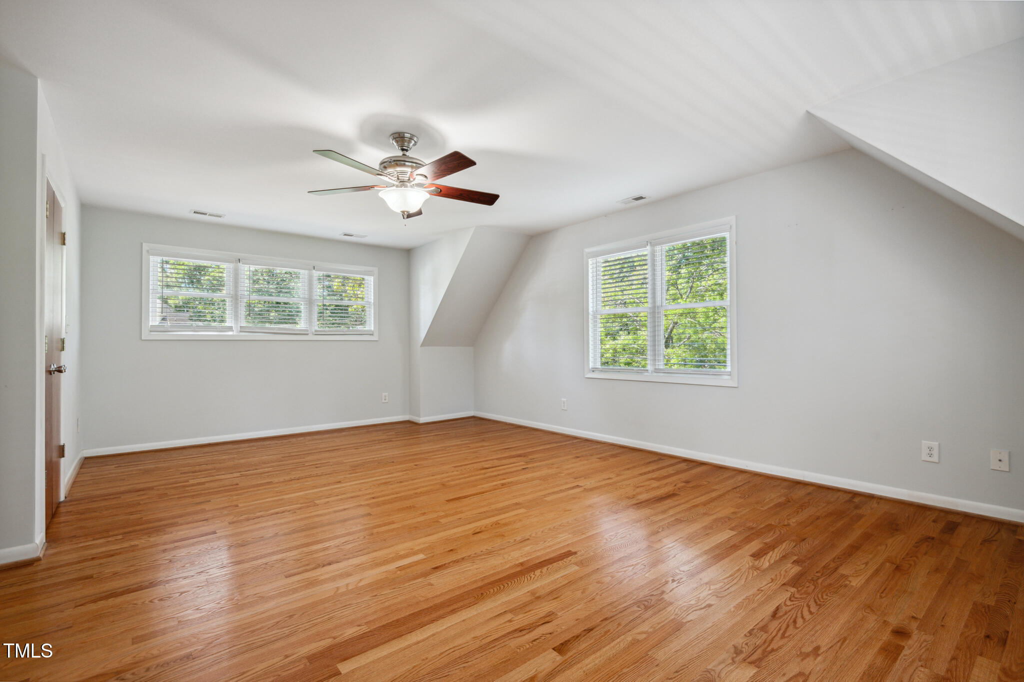205 Northfield Drive Raleigh, NC 27609 - Photo 49 of 87 wooden floor in an empty room with a window