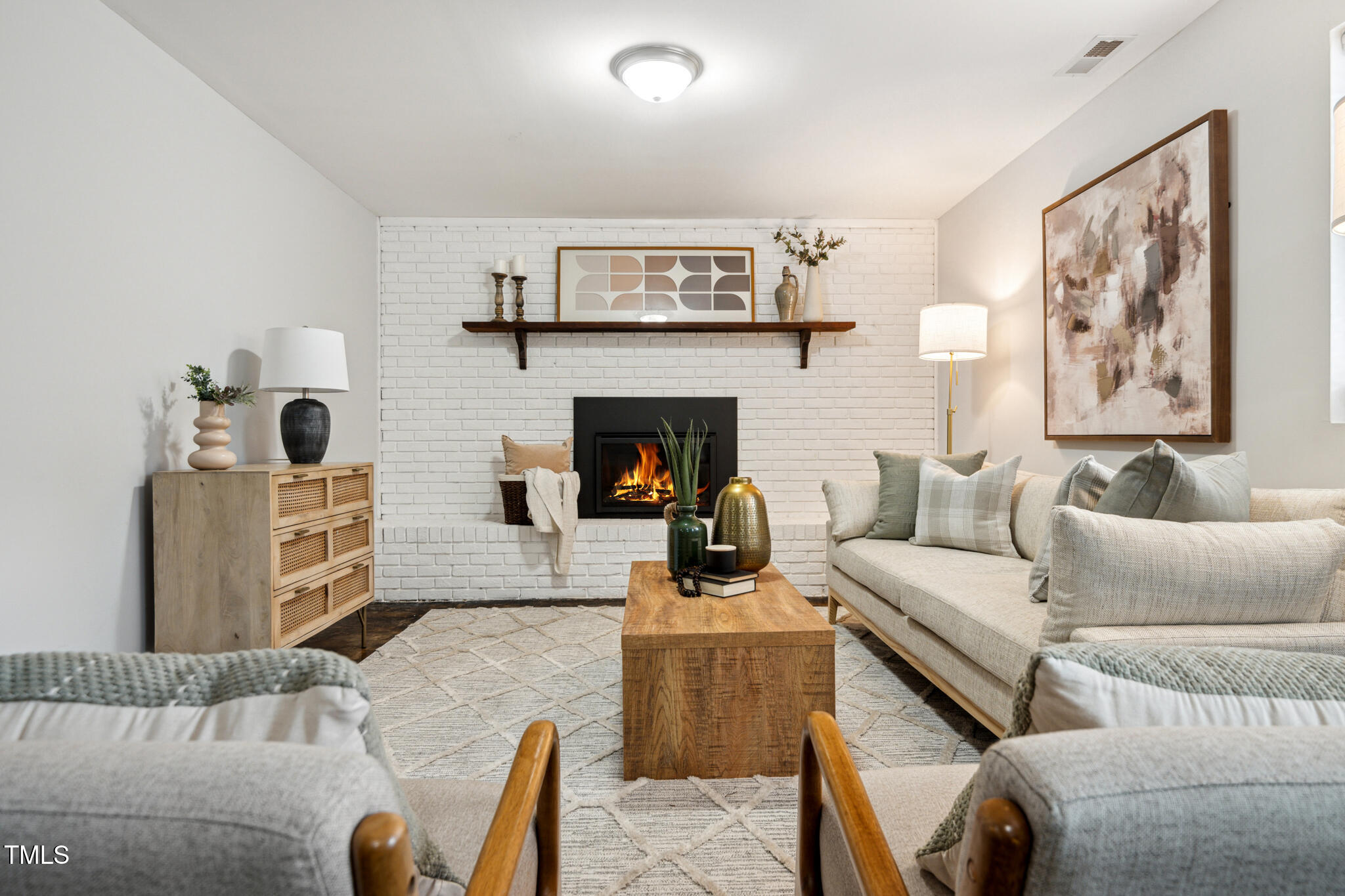 205 Northfield Drive Raleigh, NC 27609 - Photo 60 of 87 a living room with furniture and a fireplace