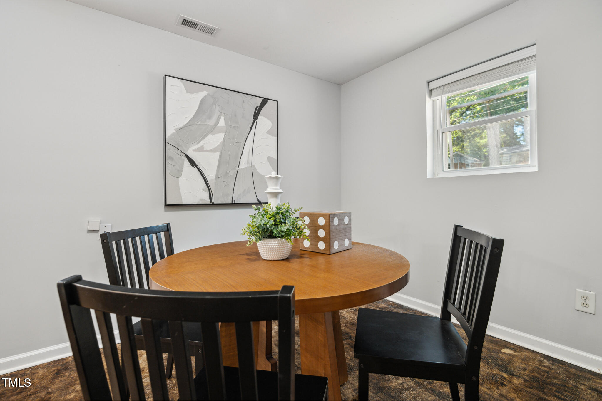 205 Northfield Drive Raleigh, NC 27609 - Photo 65 of 87 a view of a dining room with furniture window and wooden floor