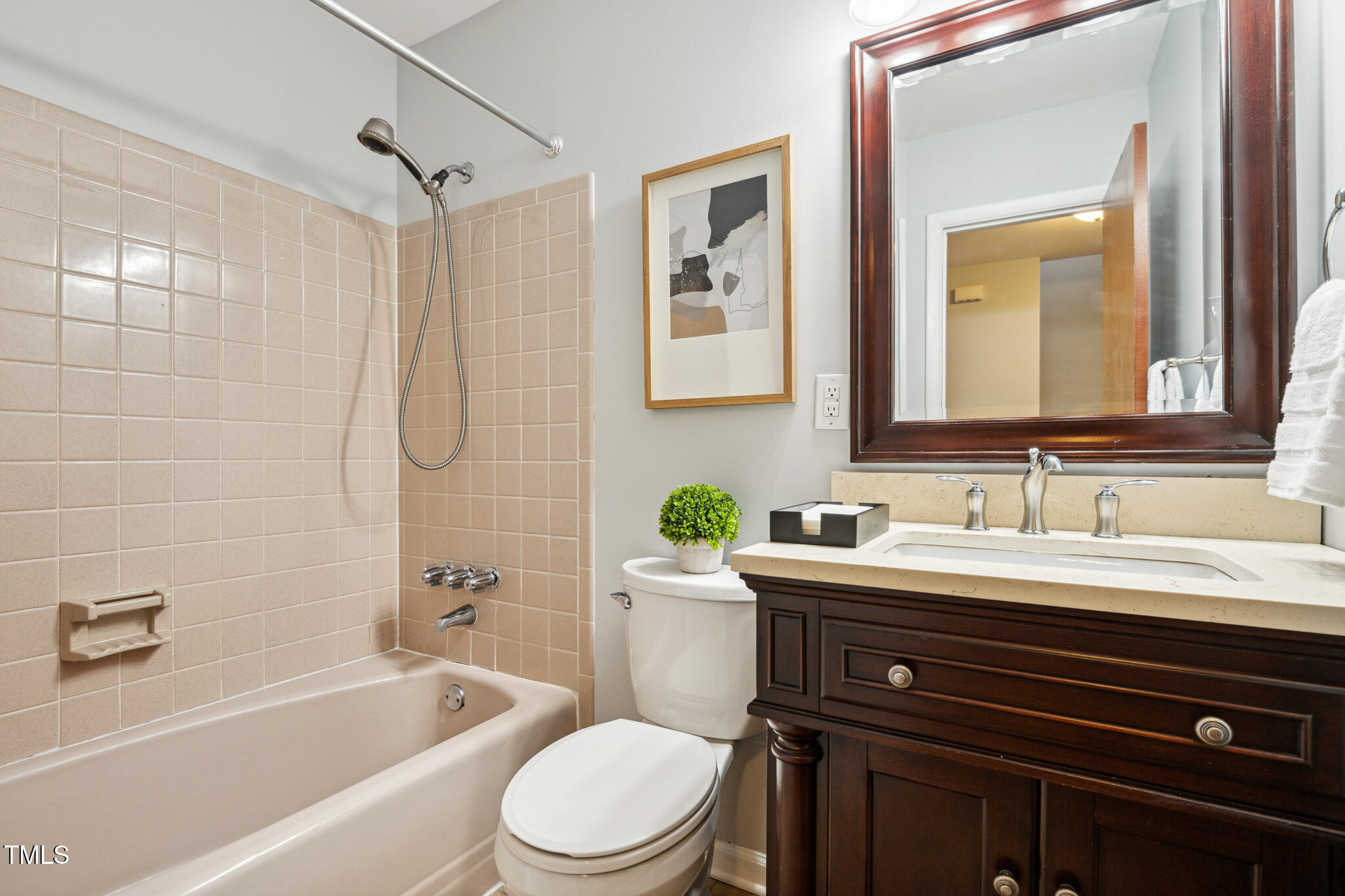 205 Northfield Drive Raleigh, NC 27609 - Photo 73 of 87 a bathroom with a sink a toilet and a bathtub