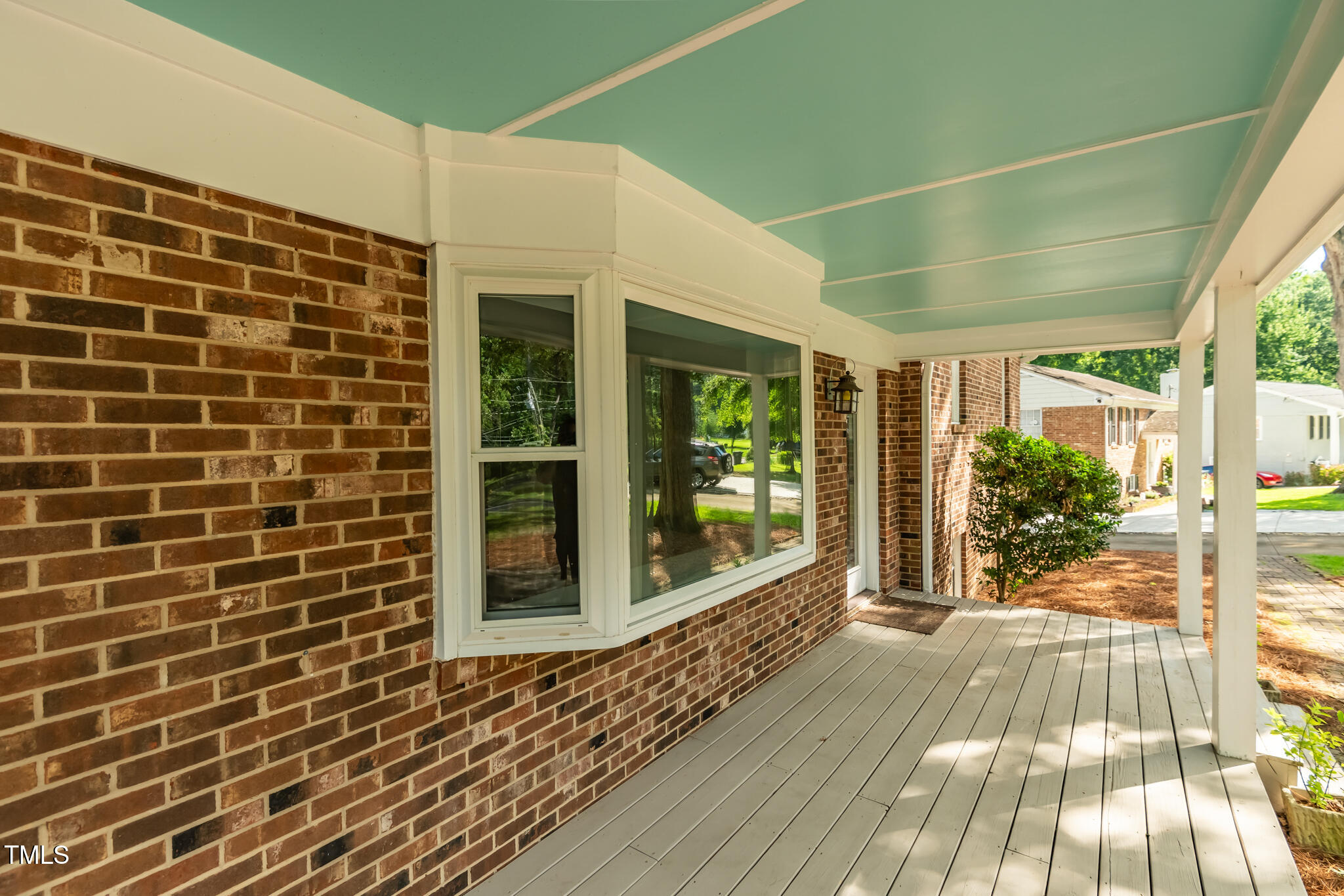 205 Northfield Drive Raleigh, NC 27609 - Photo 9 of 87 a view of a brick house with a large window