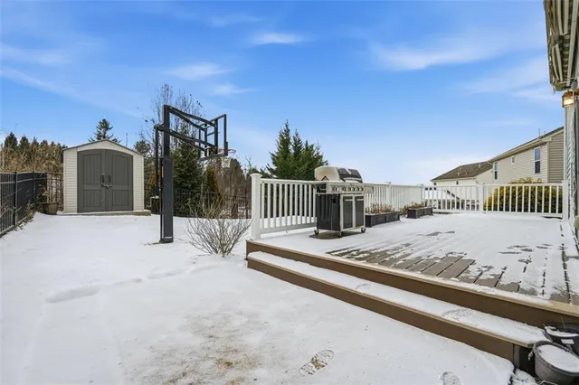 a kitchen with stainless steel appliances granite countertop a refrigerator a stove top oven a sink and dishwasher