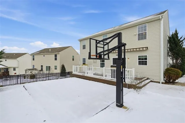 a kitchen with stainless steel appliances granite countertop a stove a sink dishwasher a refrigerator and a microwave oven with wooden floor