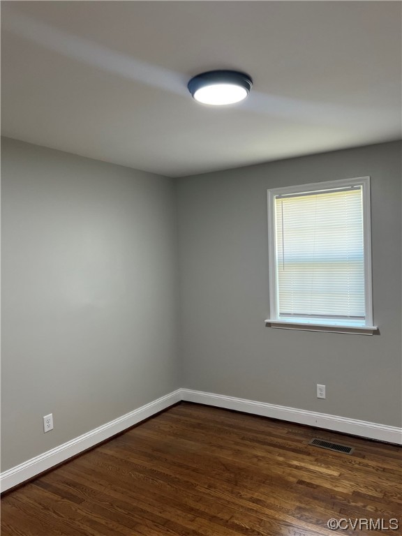 809 St James Street Petersburg, VA 23803 - Photo 5 of 9 a view of an empty room with wooden floor and a window