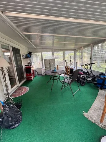 a view of a kids room with furniture