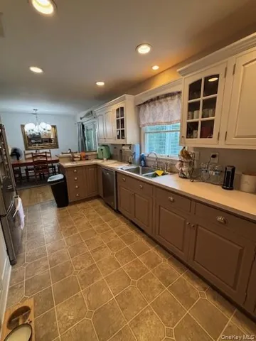 a kitchen with lots of counter top space and appliances