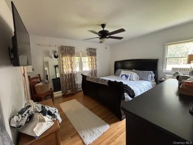 a bed room with a bed window and a chair