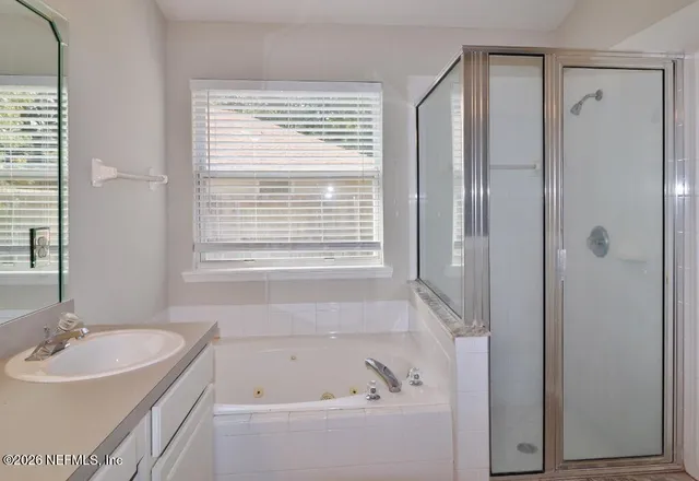 a bathroom with a bathtub and a sink