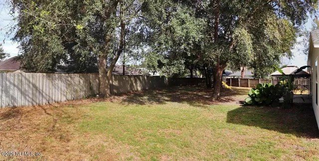 a view of a back yard of the house