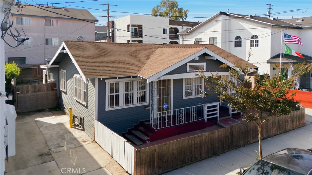 1724 East 10th Street Long Beach, CA 90813 - Photo 1 of 25 a view of a house with a yard and potted plants