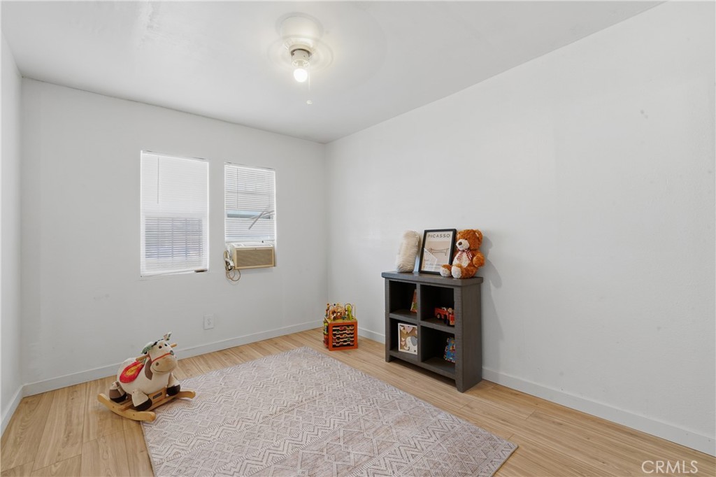 1724 East 10th Street Long Beach, CA 90813 - Photo 13 of 25 a view of a workspace with furniture and wooden floor
