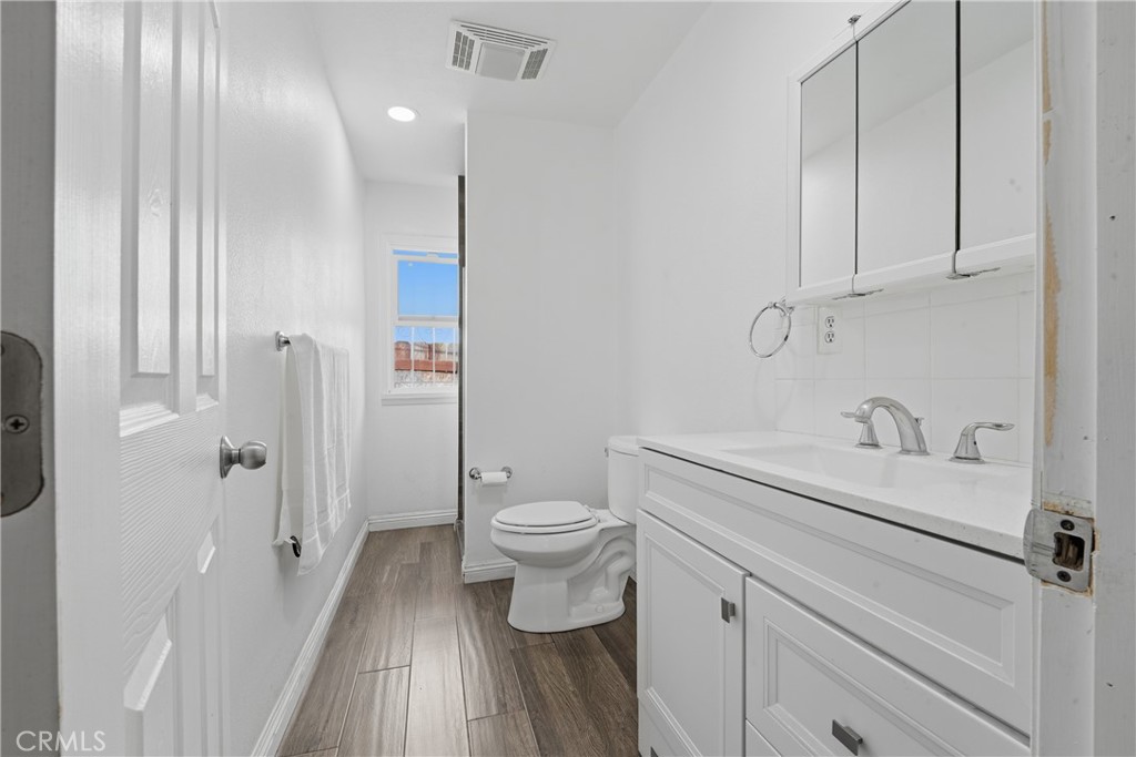 1724 East 10th Street Long Beach, CA 90813 - Photo 17 of 25 a bathroom with a sink a toilet and shower
