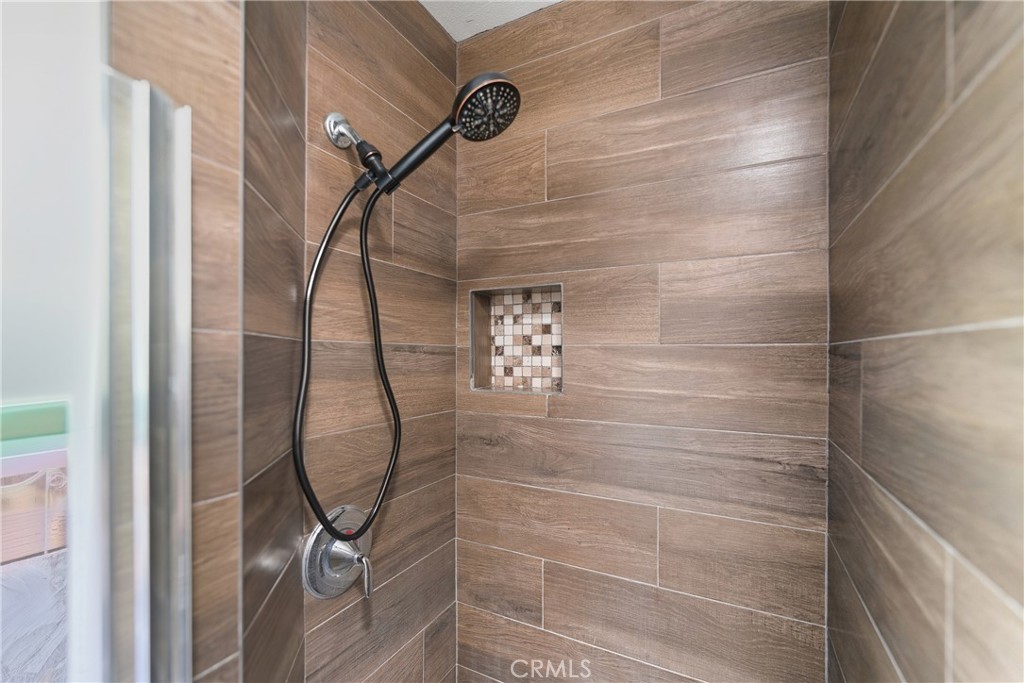 1724 East 10th Street Long Beach, CA 90813 - Photo 18 of 25 a bathroom with a glass shower door