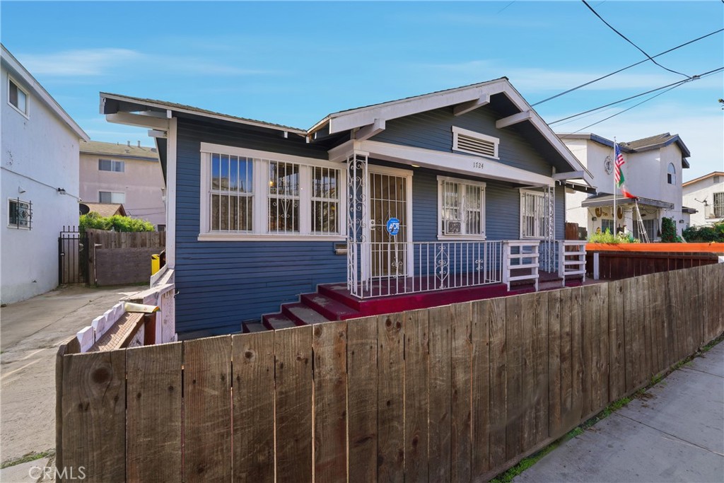 1724 East 10th Street Long Beach, CA 90813 - Photo 3 of 25 a view of a house with wooden fence