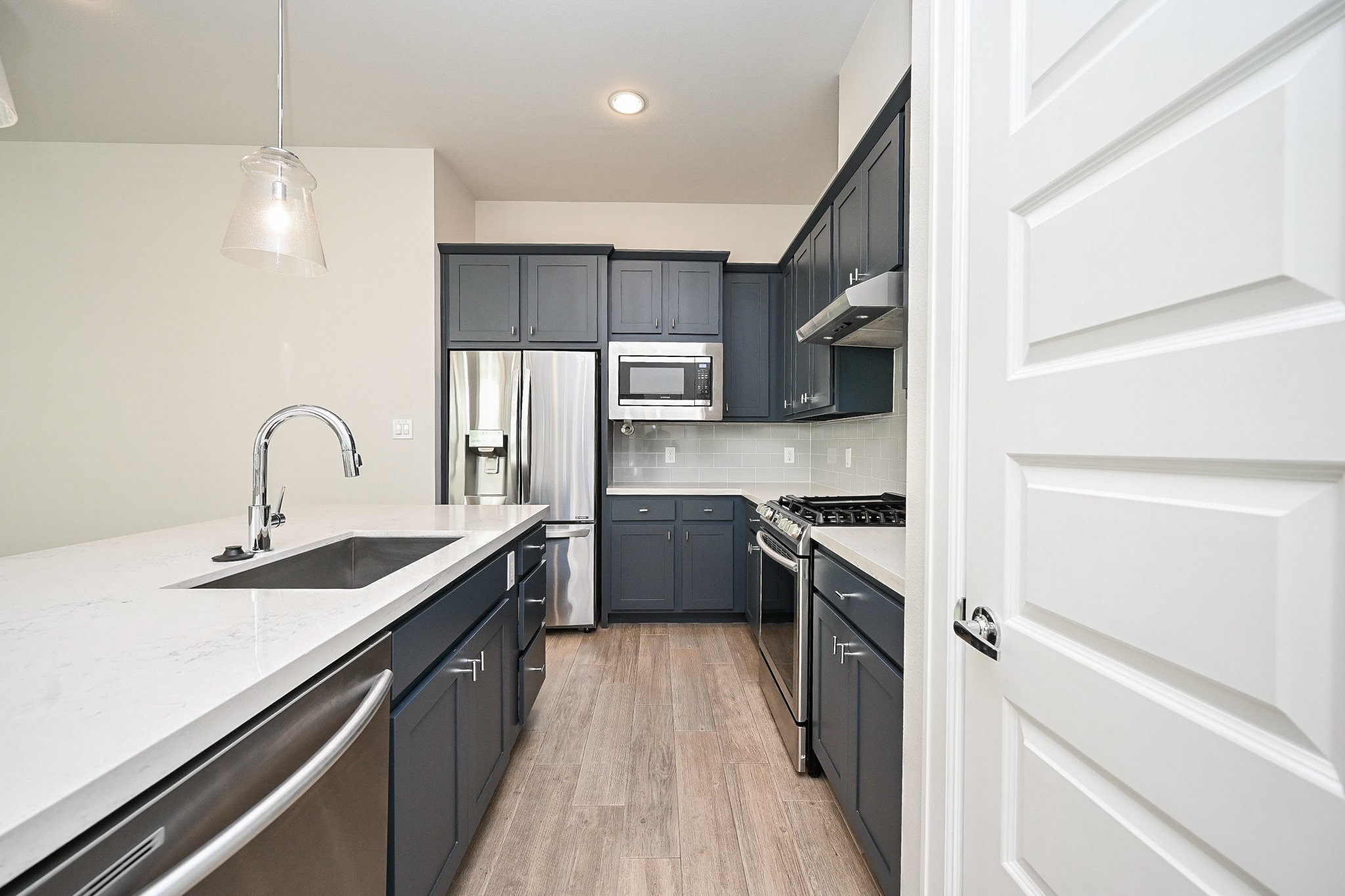 651 Press Street Houston, TX 77020 - Photo 6 of 20 a kitchen with a sink stainless steel appliances and cabinets