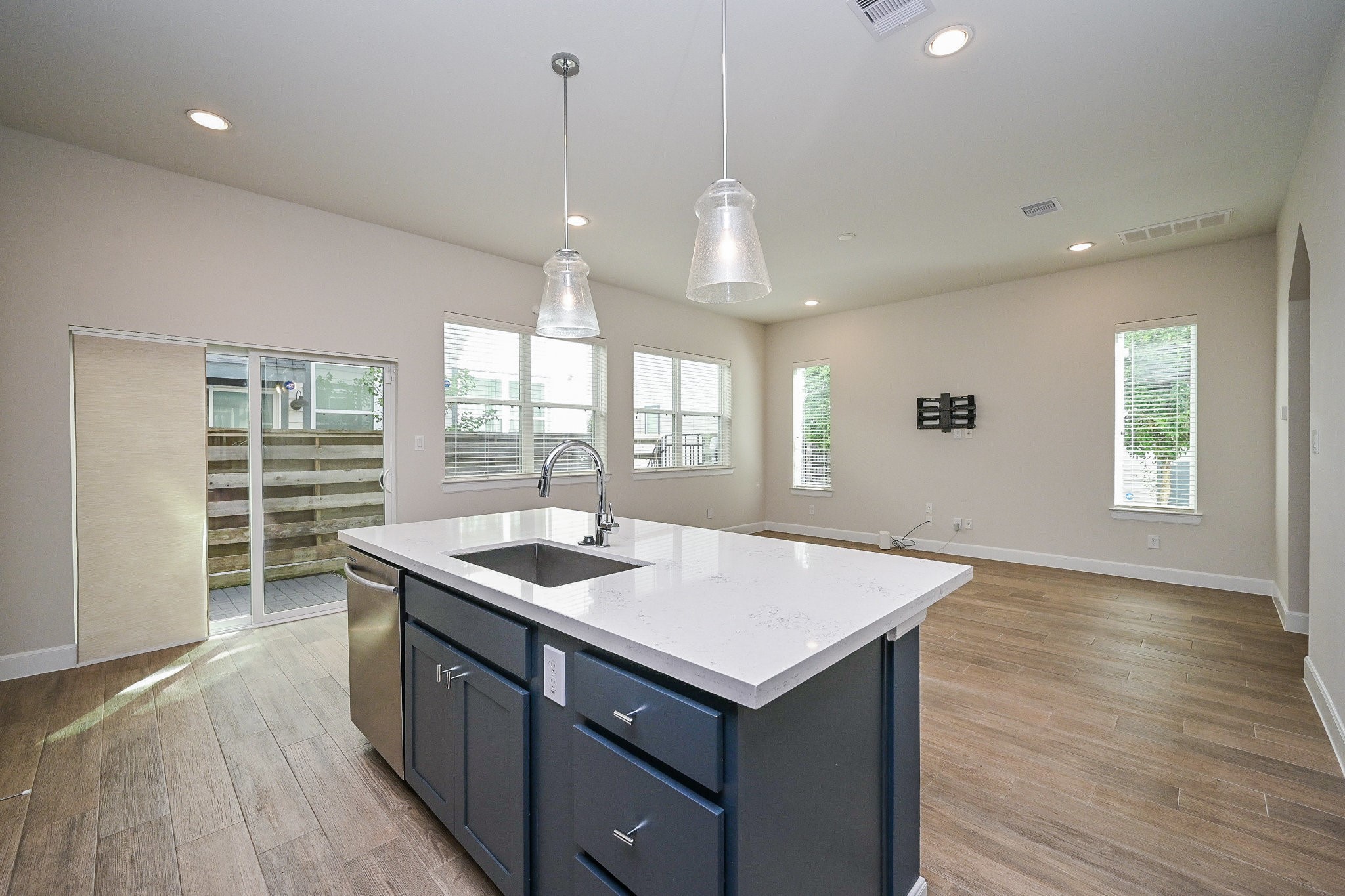 651 Press Street Houston, TX 77020 - Photo 7 of 20 a kitchen that has a sink a stove and a wooden floor