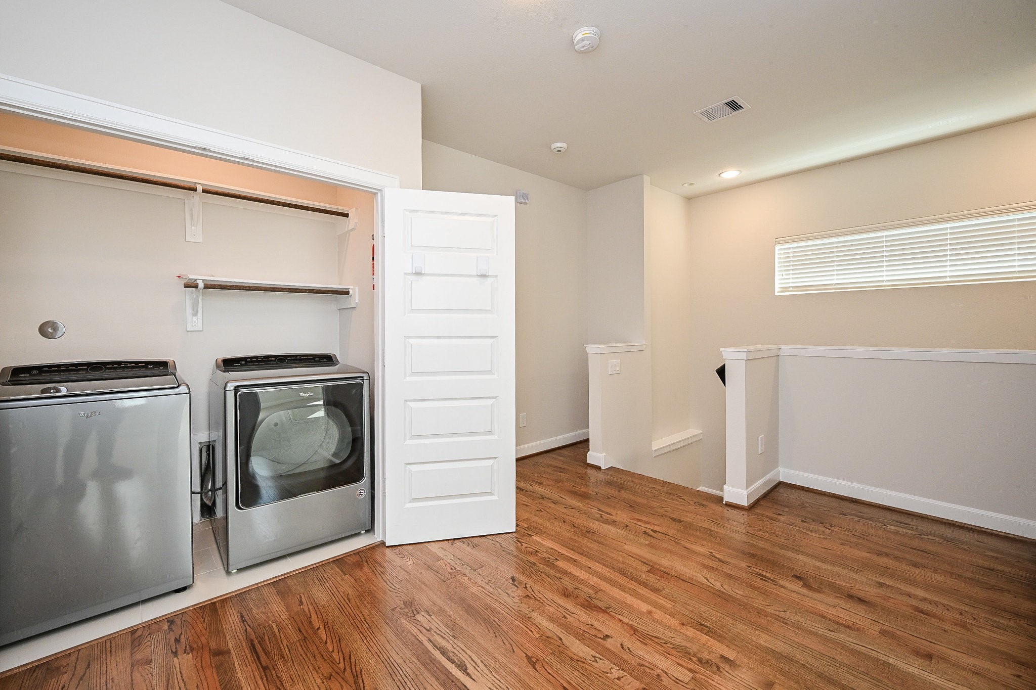 651 Press Street Houston, TX 77020 - Photo 8 of 20 a view of empty room with wooden floor and cabinet