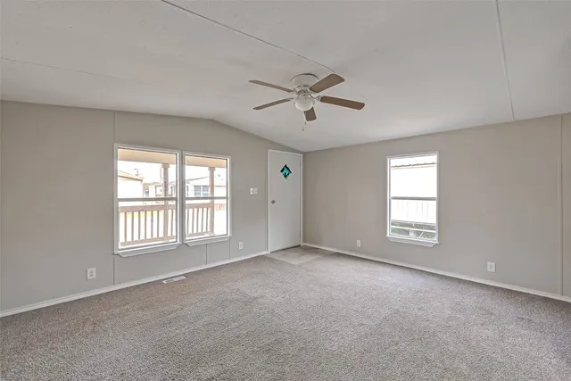 a view of empty room with windows
