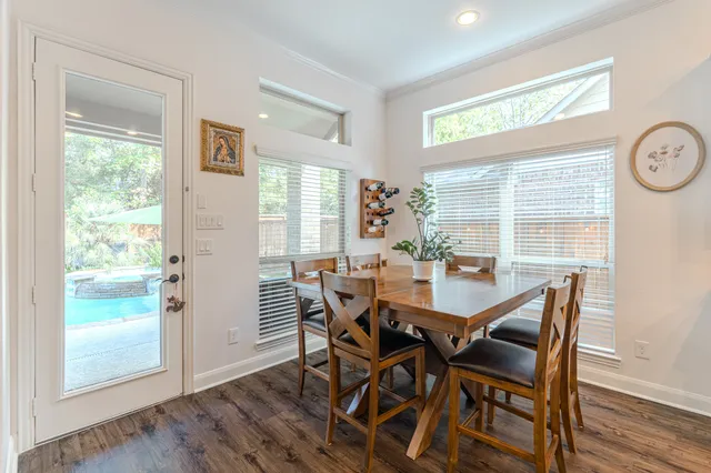 a view of a dining room with furniture and wooden floor