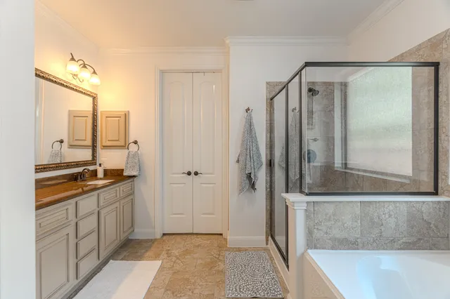 a bathroom with a double vanity sink and a mirror