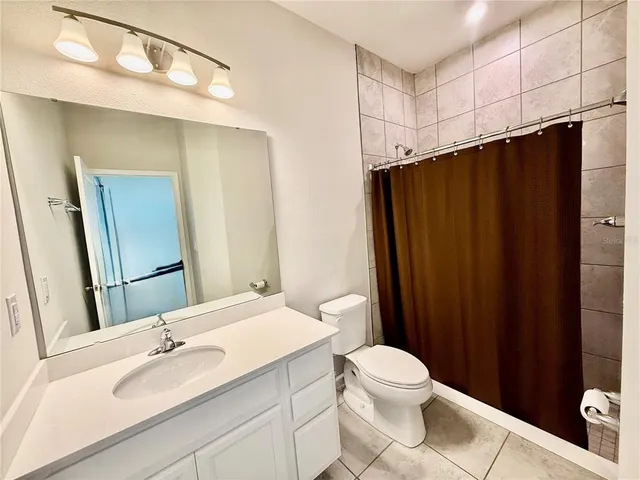 a kitchen with stainless steel appliances granite countertop a sink a stove and cabinets