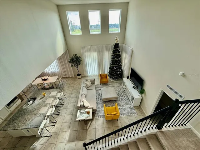 a bedroom with bed and a flat tv screen