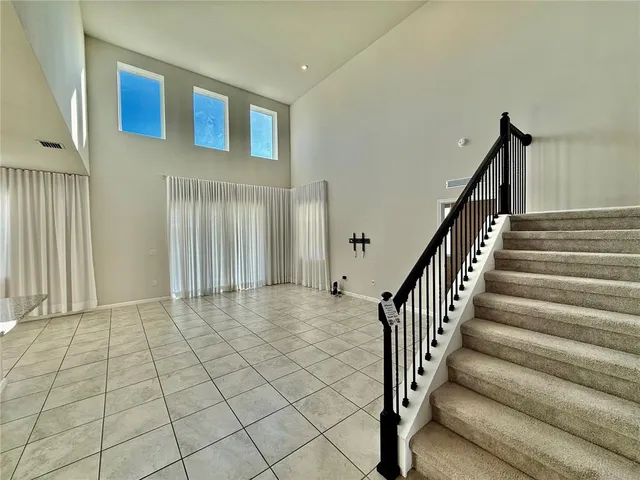 a view of a house with backyard and porch