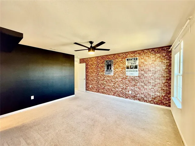 a view of swimming pool with a table and chairs