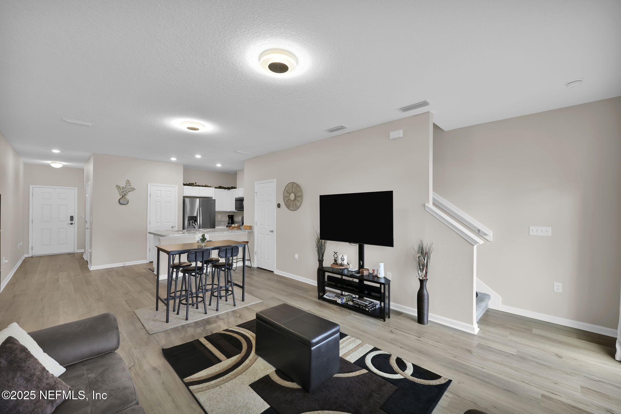 7791 Merchants Way Jacksonville, FL 32222 - Photo 11 of 21 a living room with furniture and a flat screen tv