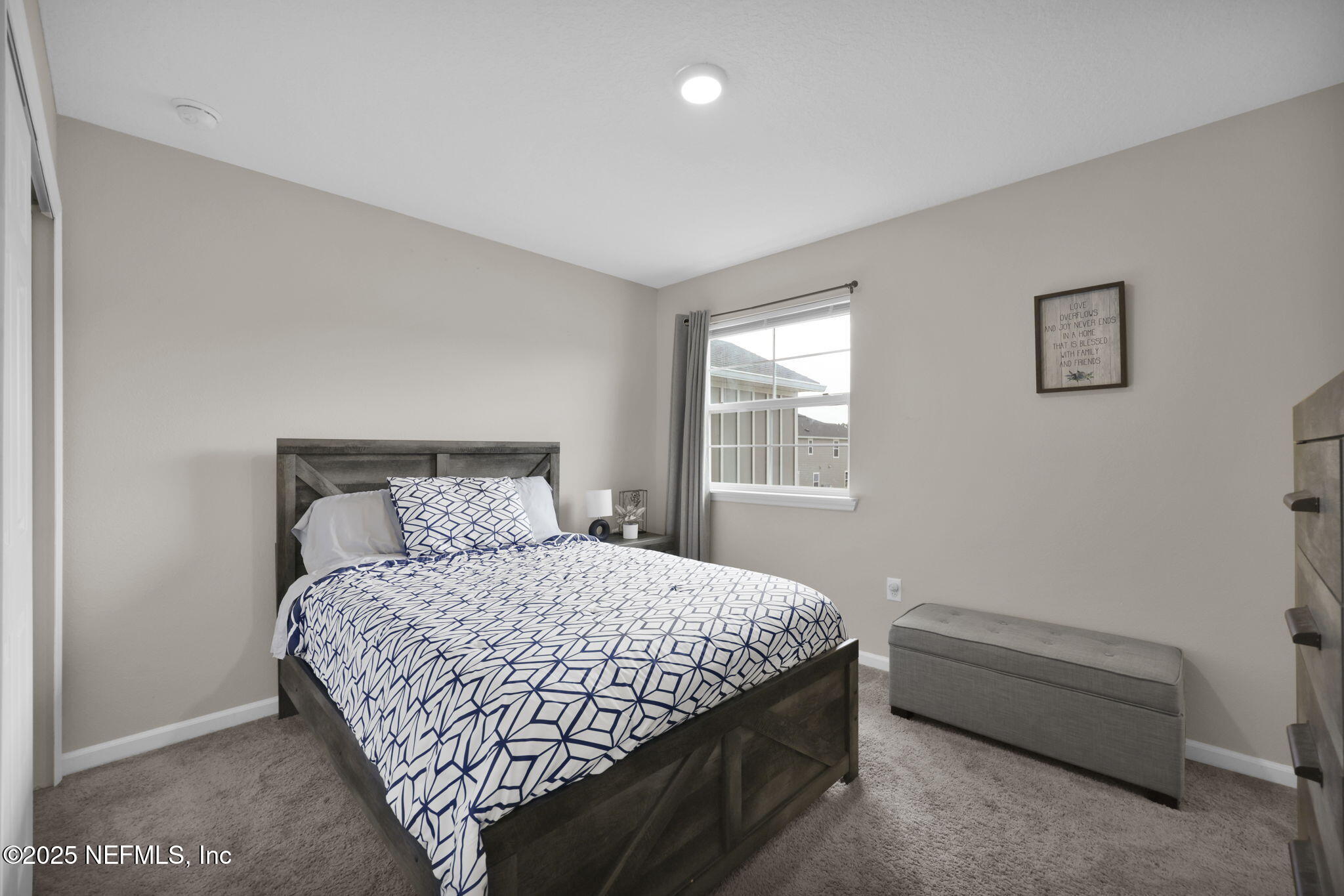 7791 Merchants Way Jacksonville, FL 32222 - Photo 14 of 21 a bedroom with a bed and a window