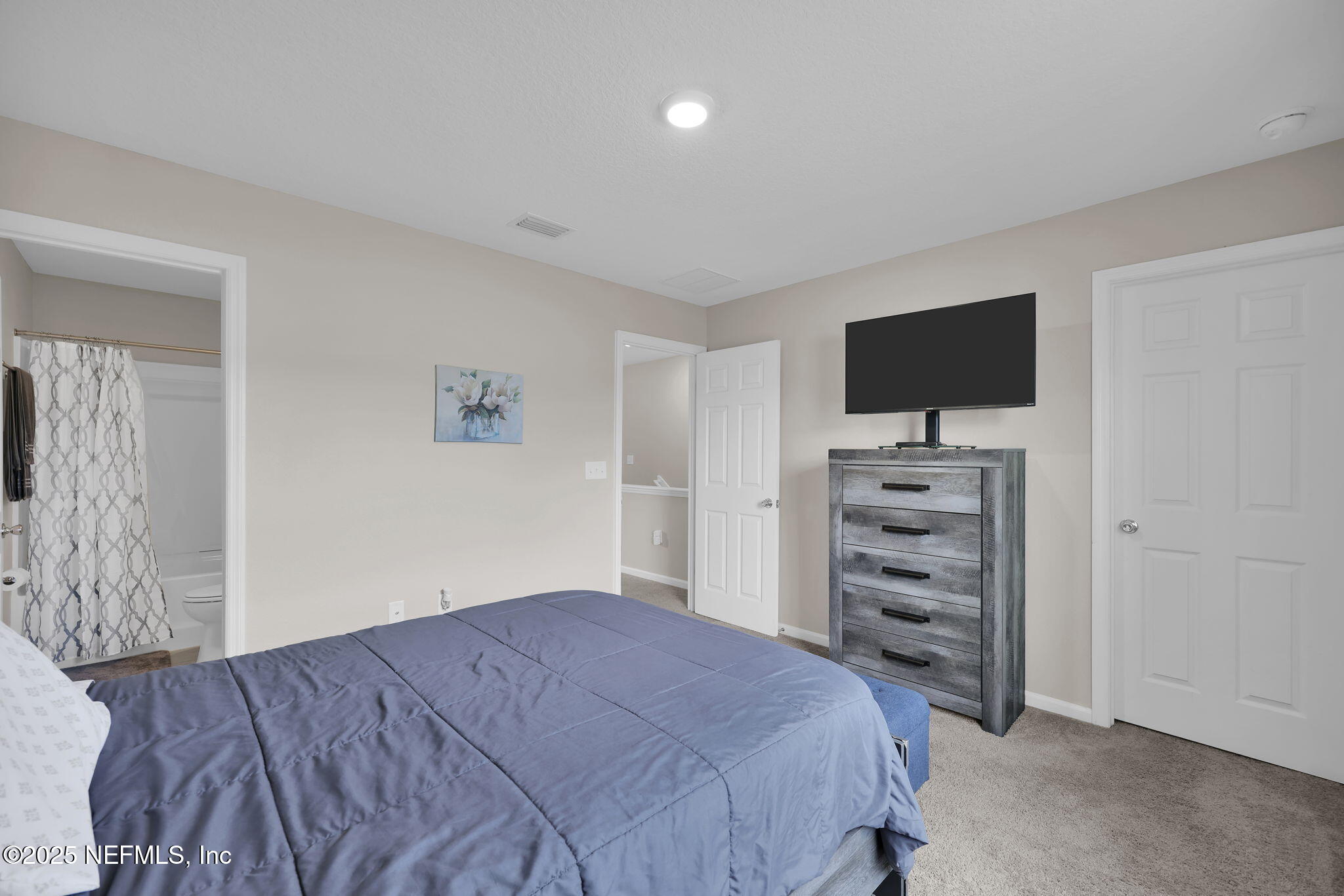 7791 Merchants Way Jacksonville, FL 32222 - Photo 17 of 21 a bedroom with a bed and a television